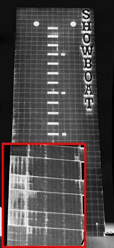 Infrared image of the exterior of a commercial building, showing moisture damage